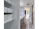 Hallway showcasing bathroom access, closet storage, and a clear view to an adjacent bedroom at 1111 N Bayshore Blvd # E3, Clearwater, FL 33759