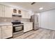 Modern kitchen with stainless steel appliances, sleek countertops, and ample cabinet space at 1111 N Bayshore Blvd # E3, Clearwater, FL 33759