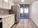 Bright kitchen with stainless steel appliances and sliding door to a back patio at 1111 N Bayshore Blvd # E3, Clearwater, FL 33759