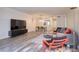 Well-lit living space with sleek furniture, a gray sofa, and a view of the dining area at 1111 N Bayshore Blvd # E3, Clearwater, FL 33759