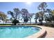 Resort-style pool with brick surround and expansive water view at 1111 N Bayshore Blvd # E3, Clearwater, FL 33759