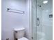 Modern bathroom featuring a glass-enclosed shower with white tile and a sleek showerhead at 1111 N Bayshore Blvd # E3, Clearwater, FL 33759