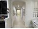 Long hallway with art displayed on the walls at 11193 Spring Point Cir, Riverview, FL 33579