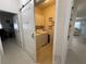 View of a laundry room with washer and dryer and overhead cabinets at 11193 Spring Point Cir, Riverview, FL 33579