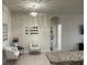 Bright living room with chandelier lighting, seating area, and arched doorway at 11193 Spring Point Cir, Riverview, FL 33579