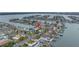 Overhead of waterfront community with canals, boat docks, and houses, showcasing location at 11755 7Th E St, Treasure Island, FL 33706