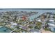 Beautiful waterfront home featuring lush landscaping and private boat dock access to the Gulf at 11755 7Th E St, Treasure Island, FL 33706
