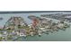 Waterfront home featuring lush landscaping and private boat dock access to open water at 11755 7Th E St, Treasure Island, FL 33706