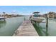 A private dock provides access to waterfront living, complete with a boat lift for easy storage and maintenance at 11755 7Th E St, Treasure Island, FL 33706