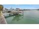 Waterfront dock with a boat lift and views of the canal, perfect for boating enthusiasts at 11755 7Th E St, Treasure Island, FL 33706