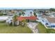 Charming waterfront home with a red tile roof, stone accents, and a spacious driveway at 11755 7Th E St, Treasure Island, FL 33706