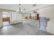 Open living space in need of remodel features view of front door, wall decor, and den at 11755 7Th E St, Treasure Island, FL 33706