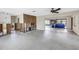 Wide open living space ready for renovation, with view to den area with stone wall at 11755 7Th E St, Treasure Island, FL 33706