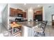Bright kitchen with a breakfast bar, granite countertops, and stainless steel appliances at 12639 Lemon Pepper Dr, Riverview, FL 33578