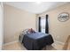 Comfortable bedroom with black out curtains and car themed decor at 14426 Haddon Mist Dr, Wimauma, FL 33598