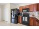 Modern kitchen featuring stainless steel appliances and ample cabinet space at 14426 Haddon Mist Dr, Wimauma, FL 33598