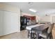 A stylish kitchen features stainless steel appliances, and a center island with bar stool seating at 14426 Haddon Mist Dr, Wimauma, FL 33598