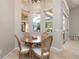 Cozy breakfast nook with round table, seating, and views of the lanai at 14809 Tudor Chase Dr, Tampa, FL 33626