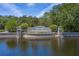 Waterchase community entrance sign surrounded by serene water features at 14809 Tudor Chase Dr, Tampa, FL 33626