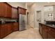 Traditional kitchen featuring stainless steel appliances, granite countertops, and tile flooring at 14809 Tudor Chase Dr, Tampa, FL 33626
