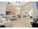 Bright, open living space with tile floors, glass doors, and easy access to the kitchen at 14809 Tudor Chase Dr, Tampa, FL 33626