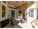 Cozy covered patio area with outdoor furniture, ceiling fan, and a view of the yard at 14809 Tudor Chase Dr, Tampa, FL 33626