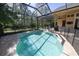 Relaxing screened-in pool featuring a safety fence, perfect for enjoying the outdoors at 14809 Tudor Chase Dr, Tampa, FL 33626