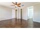 Bedroom featuring tile floor, ceiling fan, and multiple doorways and closets at 16012 Ballica Dr, Tampa, FL 33618