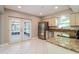 Well-equipped kitchen with stainless steel appliances, granite countertops, and tile flooring at 16012 Ballica Dr, Tampa, FL 33618