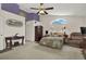 Spacious bedroom with high ceilings, ceiling fan, and ample natural light at 17108 Longacres Ln, Odessa, FL 33556
