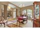 Formal dining room features elegant furniture with a view of other rooms in the house at 17108 Longacres Ln, Odessa, FL 33556
