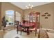 Elegant dining room featuring a chandelier, china cabinet, and large arched window at 17108 Longacres Ln, Odessa, FL 33556