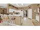 Bright kitchen with white cabinets, breakfast bar, and modern appliances at 17108 Longacres Ln, Odessa, FL 33556