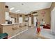 Kitchen features a breakfast bar with seating, ample counter space, and neutral color palette at 17108 Longacres Ln, Odessa, FL 33556
