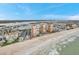 Expansive aerial of beachfront condos with ocean view, swimming pool, and coastal living amenities at 17940 Gulf Blvd # 2D, Redington Shores, FL 33708