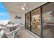 Enjoy the private balcony with comfortable seating and beautiful beach views through sliding glass doors at 17940 Gulf Blvd # 2D, Redington Shores, FL 33708