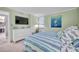 Cozy bedroom with beach-inspired décor, dresser, and comfortable furnishings at 17940 Gulf Blvd # 2D, Redington Shores, FL 33708