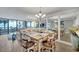 Open-concept dining room with views of the ocean and access to the living area at 17940 Gulf Blvd # 2D, Redington Shores, FL 33708