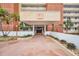 Inviting entrance with well-maintained landscaping, a covered entryway, and clear signage at the beach condo at 17940 Gulf Blvd # 2D, Redington Shores, FL 33708