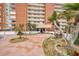 Beach condo complex with inviting entrance, lush landscaping, and a welcoming atmosphere at 17940 Gulf Blvd # 2D, Redington Shores, FL 33708