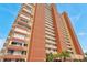 Exterior view of a multi-story beachfront condo featuring private balconies with panoramic ocean views at 17940 Gulf Blvd # 2D, Redington Shores, FL 33708