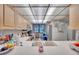 Bright kitchen features a window, tiled ceiling, and ample cabinet space at 17940 Gulf Blvd # 2D, Redington Shores, FL 33708