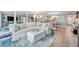 Living room has a large sectional, coastal accents, and an open floor plan at 17940 Gulf Blvd # 2D, Redington Shores, FL 33708