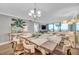 Open-concept living and dining area has views of the ocean, and modern decor at 17940 Gulf Blvd # 2D, Redington Shores, FL 33708
