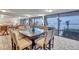 Bright common area includes a large table with beach views through expansive windows at 17940 Gulf Blvd # 2D, Redington Shores, FL 33708