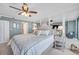 Comfortable main bedroom with neutral tones, mirrors, and an open doorway at 17940 Gulf Blvd # 2D, Redington Shores, FL 33708