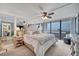 Bright primary bedroom features ocean views, mirror accents, and a ceiling fan at 17940 Gulf Blvd # 2D, Redington Shores, FL 33708