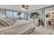 Bright main bedroom boasts a large window with beach views and coastal decor at 17940 Gulf Blvd # 2D, Redington Shores, FL 33708