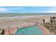 Beachfront pool with palm trees and ocean views, perfect for relaxing condo living at 17940 Gulf Blvd # 2D, Redington Shores, FL 33708