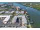 Aerial view of the complex, highlighting the pool area and boat docks with access to the Gulf of Mexico at 19417 Gulf Blvd # B-210, Indian Shores, FL 33785